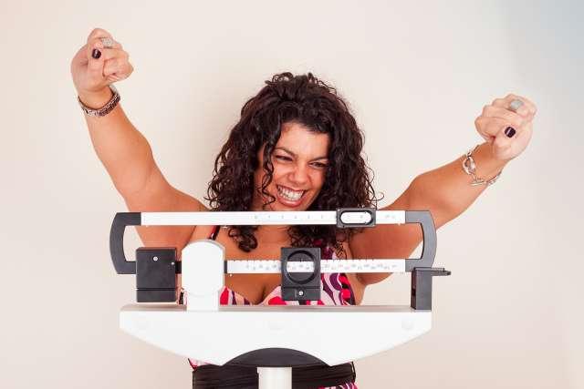 Woman happy with scale measurements
