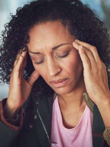 Mature woman experiencing a headache